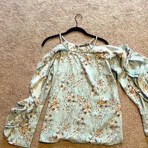 Floral cold shoulder long sleeve top.